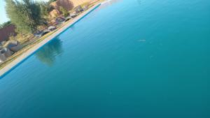 an aerial view of the water at a resort at Sasa in Ech Chaïbat +1 photo