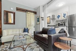 a living room with a couch and a table at Beautiful 1-BR Flat Nestled Between Dupont & Logan in Washington, D.C.