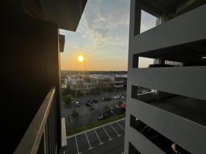 a view of the sunset from the balcony of a building at Casa D'Faiz Alanis near KLIA pool olympic size in Sepang