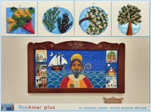 a painting of a man on a wall with other pictures at RosAmar in Bari