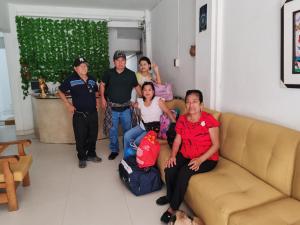 a group of people sitting on a couch in a living room at Samak Wasi in Tarapoto