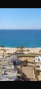 a view of a beach with houses and the ocean at شاليه فندقي mountain view north coast in Ras Elhekma