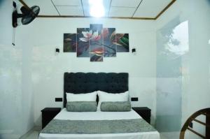 Postel nebo postele na pokoji v ubytování Villa 22 Negombo