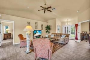 a living room with a couch and a table at Casa Dell'Amore in Murdock +35 photos