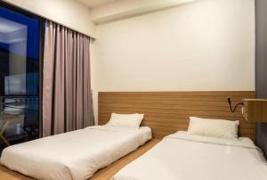 Postel nebo postele na pokoji v ubytování Kata Beach Poshtel Phuket
