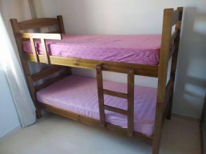 a couple of bunk beds in a room at Sobrado novo - Oktoberfest in Blumenau