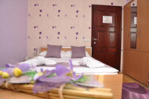 Voodi või voodid majutusasutuse Garni Hotel Laguna Lux toas