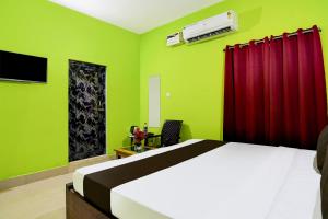 Ένα ή περισσότερα κρεβάτια σε δωμάτιο στο Super Hotel O Khushi Guest House