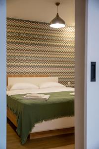 Letto o letti in una camera di Manoni Ratiani's Guesthouse