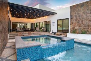 a swimming pool in the backyard of a house at Casa Samaria Valle de Guadalupe in Valle de Guadalupe