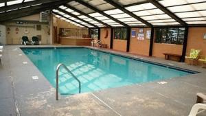 a large swimming pool in a building at Pinecliff Retreat in Ruidoso
