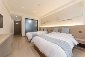 Uma cama ou camas num quarto em 乌镇闲情逸致精品民宿
