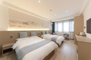 Uma cama ou camas num quarto em 乌镇闲情逸致精品民宿