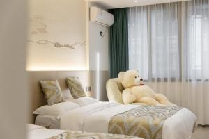 Uma cama ou camas num quarto em 乌镇闲情逸致精品民宿