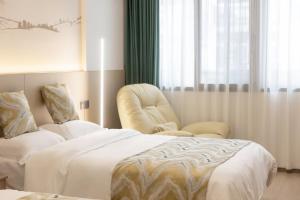 Uma cama ou camas num quarto em 乌镇闲情逸致精品民宿