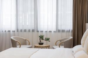 Uma cama ou camas num quarto em 乌镇闲情逸致精品民宿