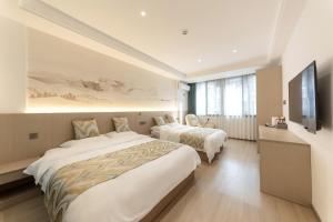 Uma cama ou camas num quarto em 乌镇闲情逸致精品民宿