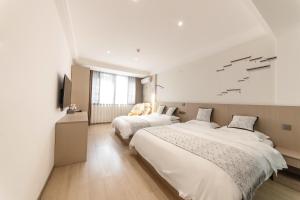 Uma cama ou camas num quarto em 乌镇闲情逸致精品民宿