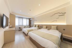 Uma cama ou camas num quarto em 乌镇闲情逸致精品民宿