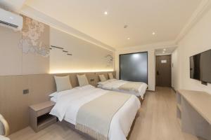 Uma cama ou camas num quarto em 乌镇闲情逸致精品民宿