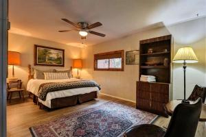 a bedroom with a bed and a ceiling fan at Ruidoso River Trail Cabin in Ruidoso
