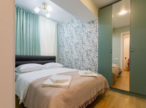 Letto o letti in una camera di Manoni Ratiani's Guesthouse