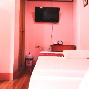 Postel nebo postele na pokoji v ubytování JayDin Travellers Inn