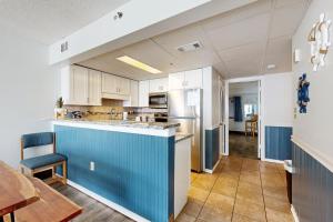 a kitchen with a blue island in the middle at Sand Dunes Resort 1450 in Myrtle Beach