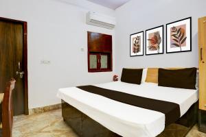 Postel nebo postele na pokoji v ubytování Hotel O HOTEL SHYAM RESIDENCY
