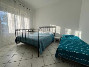 Postel nebo postele na pokoji v ubytování O&R Home Crema