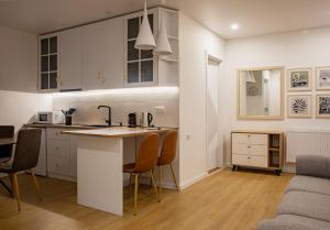 A cozinha ou kitchenette de Guesthouse of Manoni Ratiani