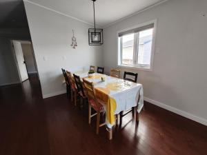 a dining room with a table and chairs at EC Lodging in Yellowknife +2 photos