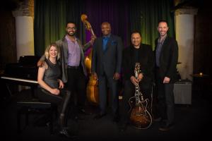 a group of people posing for a picture with instruments at Holiday Inn Express & Suites Chicago - Matteson by IHG in Matteson
