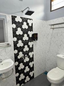 Koupelna v ubytování Homestay De Acacia Rumah Melati + 8 fotografií