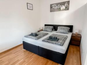 Postel nebo postele na pokoji v ubytování LEND - Design Apartment 2 + 8 fotografií