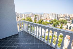 a balcony with a view of a city at iunn apartment 2 in Vlorë