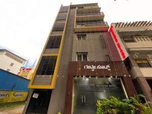 a tall building with the words tikka dance on it at Hotel Gateway Suites Bangalore Airport in Yelahanka