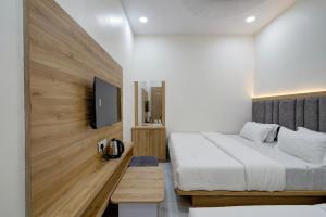 Letto o letti in una camera di Hotel Apple View,Ahmedabad