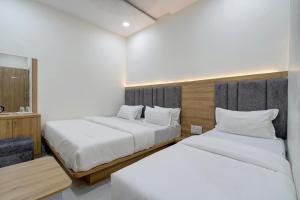 Letto o letti in una camera di Hotel Apple View,Ahmedabad