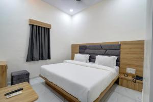 Letto o letti in una camera di Hotel Apple View,Ahmedabad
