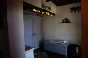 a room with a white cabinet and a blue bed at Casa VIDA in Neštin