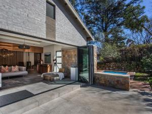 a patio of a home with a living room at Wechmarshof in Stellenbosch