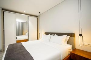 Voodi või voodid majutusasutuse Space Quality Apart Hotel toas
