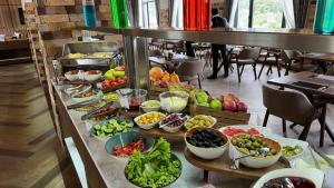 a buffet line with different types of fruits and vegetables at Hill Park Gusar in Qusar