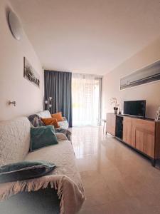 Posezení v ubytování Apartment Mare45 - 10 minutes walk from the beach with one private ombrella and two sun-beds