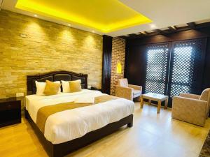 Postel nebo postele na pokoji v ubytování Hotel Matina Suites