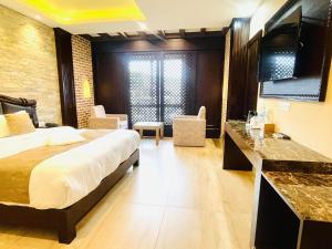 Postel nebo postele na pokoji v ubytování Hotel Matina Suites