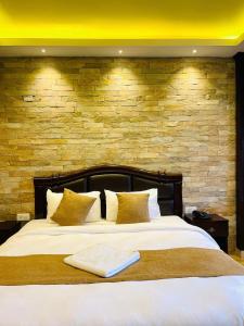 Postel nebo postele na pokoji v ubytování Hotel Matina Suites
