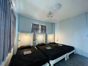 Кровать или кровати в номере Patone Hostel