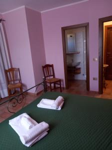 A bed or beds in a room at Agriturismo Il Borghetto